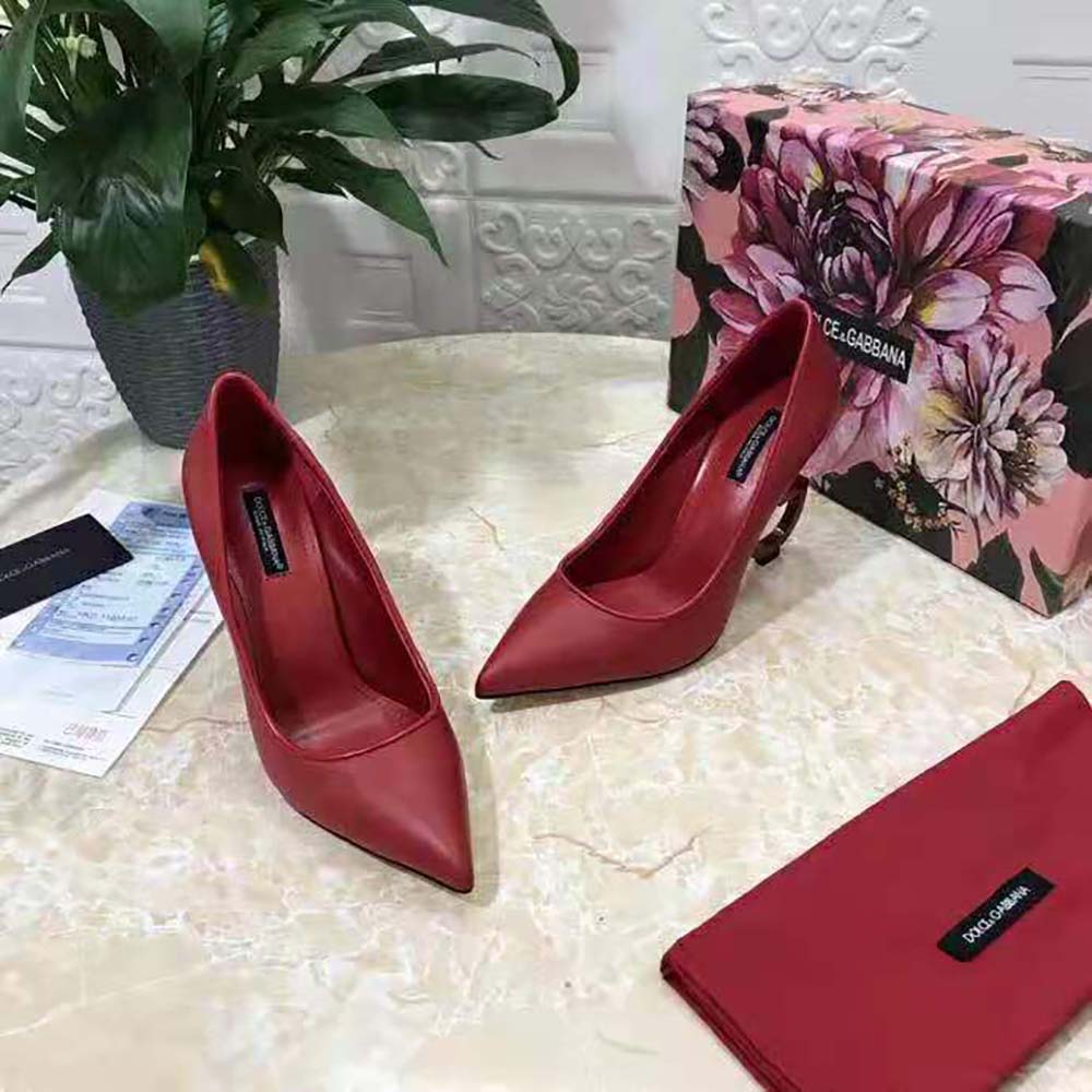 Top view of pointed toe and red nappa leather texture on Dolce Gabbana pumps