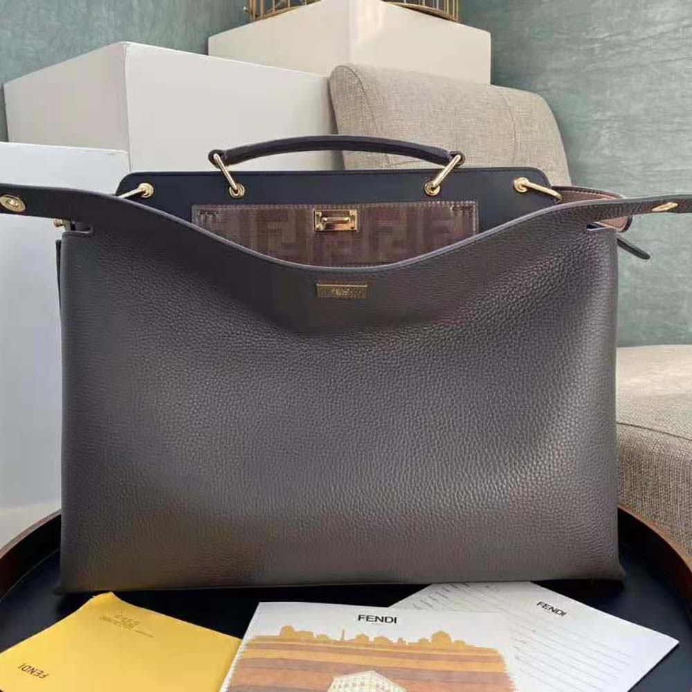Close-up of gold-tone hardware on Fendi Men Peekaboo Iconic Essential Brown Leather Bag