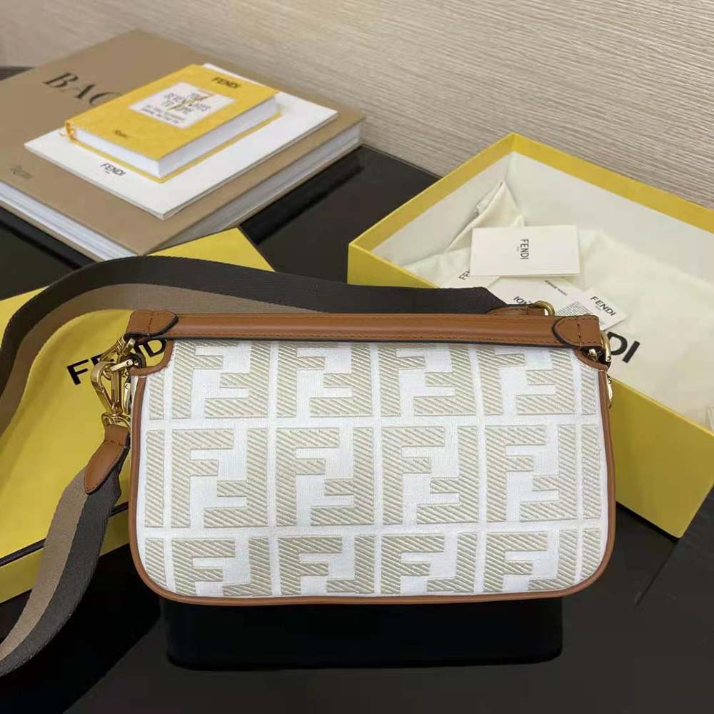 Side angle showing leather trim and magnetic closure on Fendi baguette