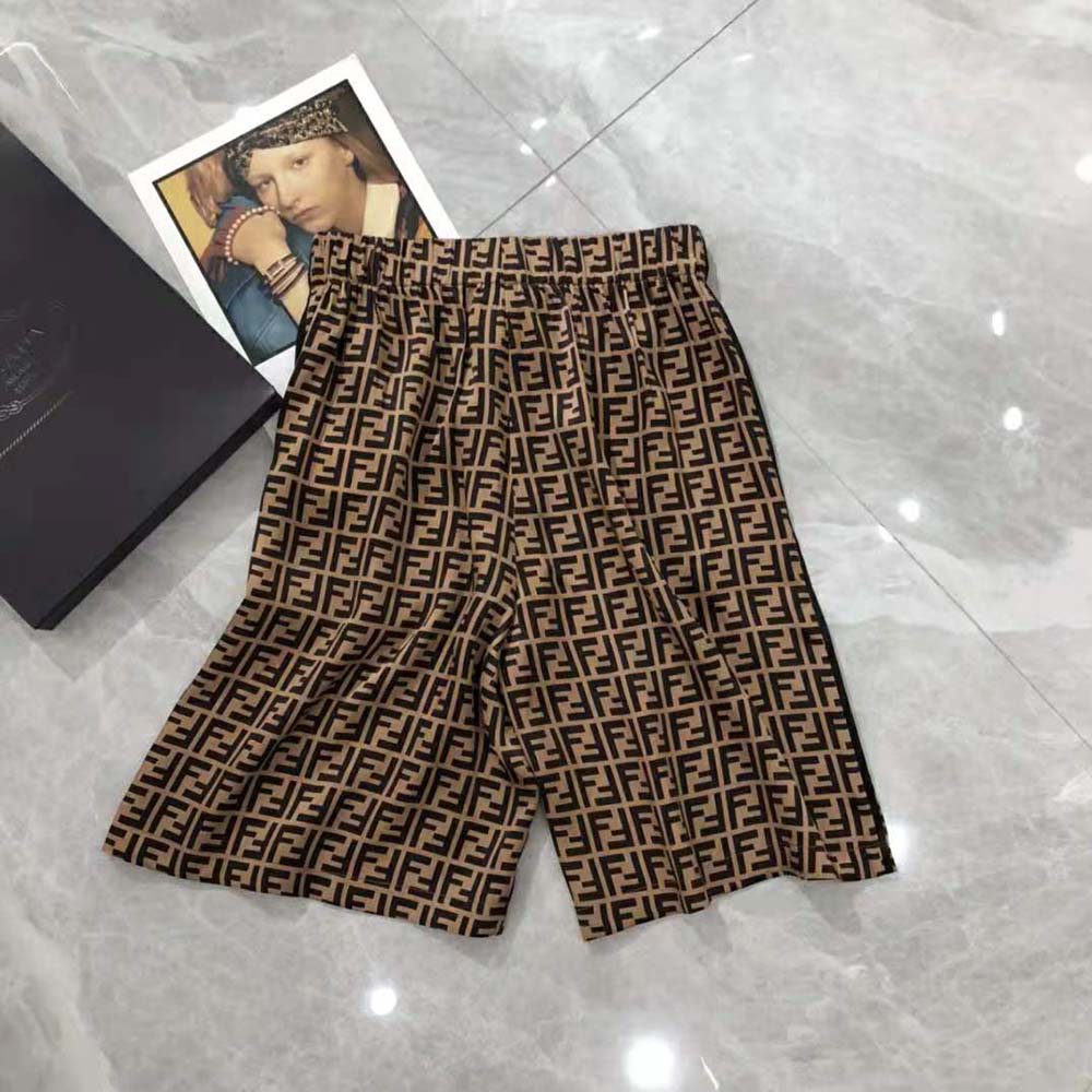 Side angle highlighting length and silhouette of Fendi Women Bermudas Brown twill Bermudas