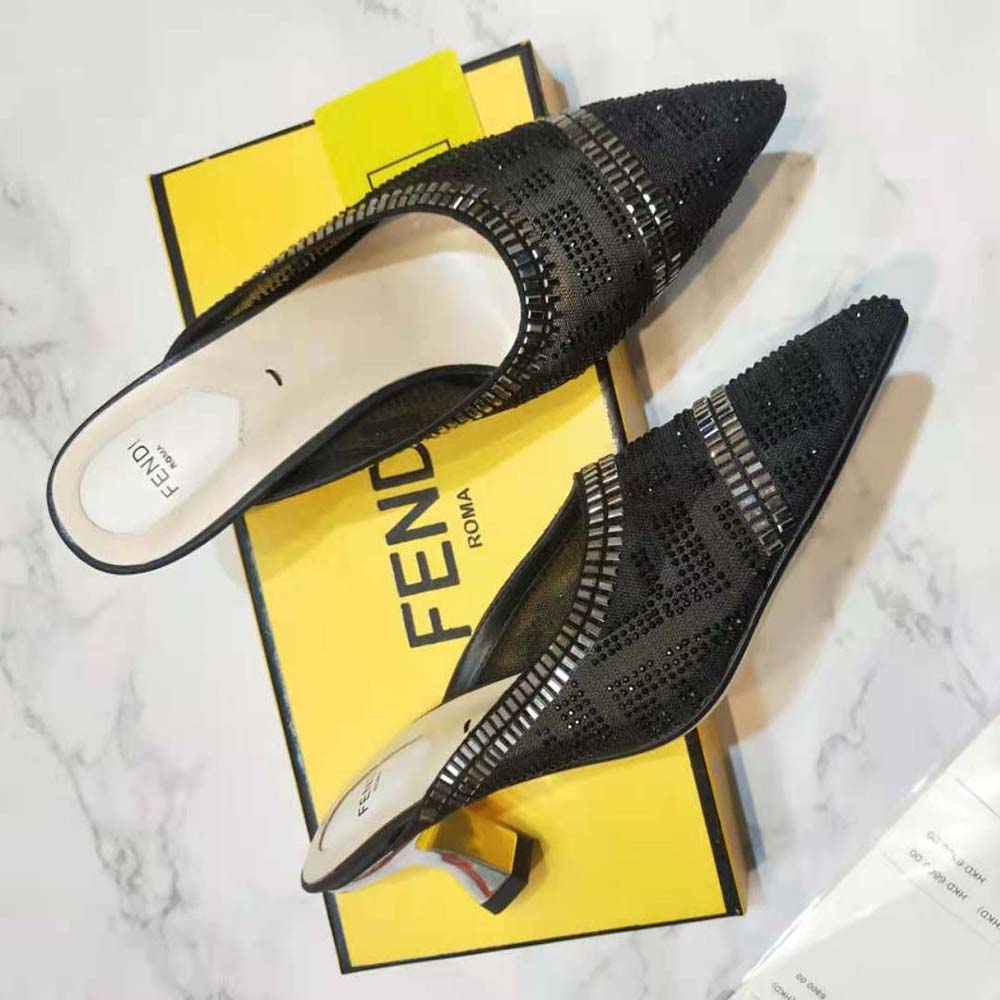 Top close-up of black leather and breathable mesh on Fendi Colibri Sabots