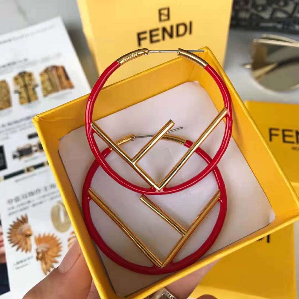 Side angle showing red and gold finish of Fendi Women F is Fendi Earrings Gold Colored Earrings-Red