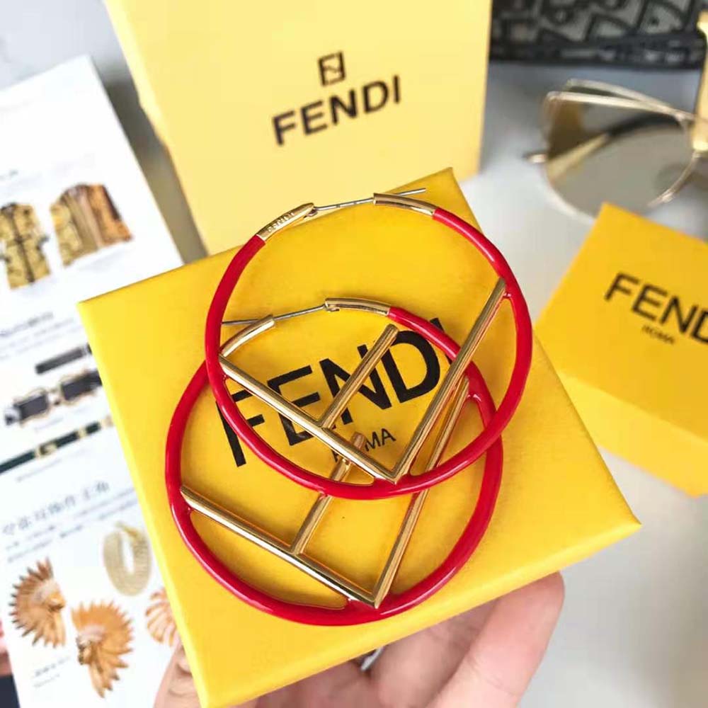 Close-up of Fendi logo detail on Fendi Women F is Fendi Earrings Gold Colored Earrings-Red