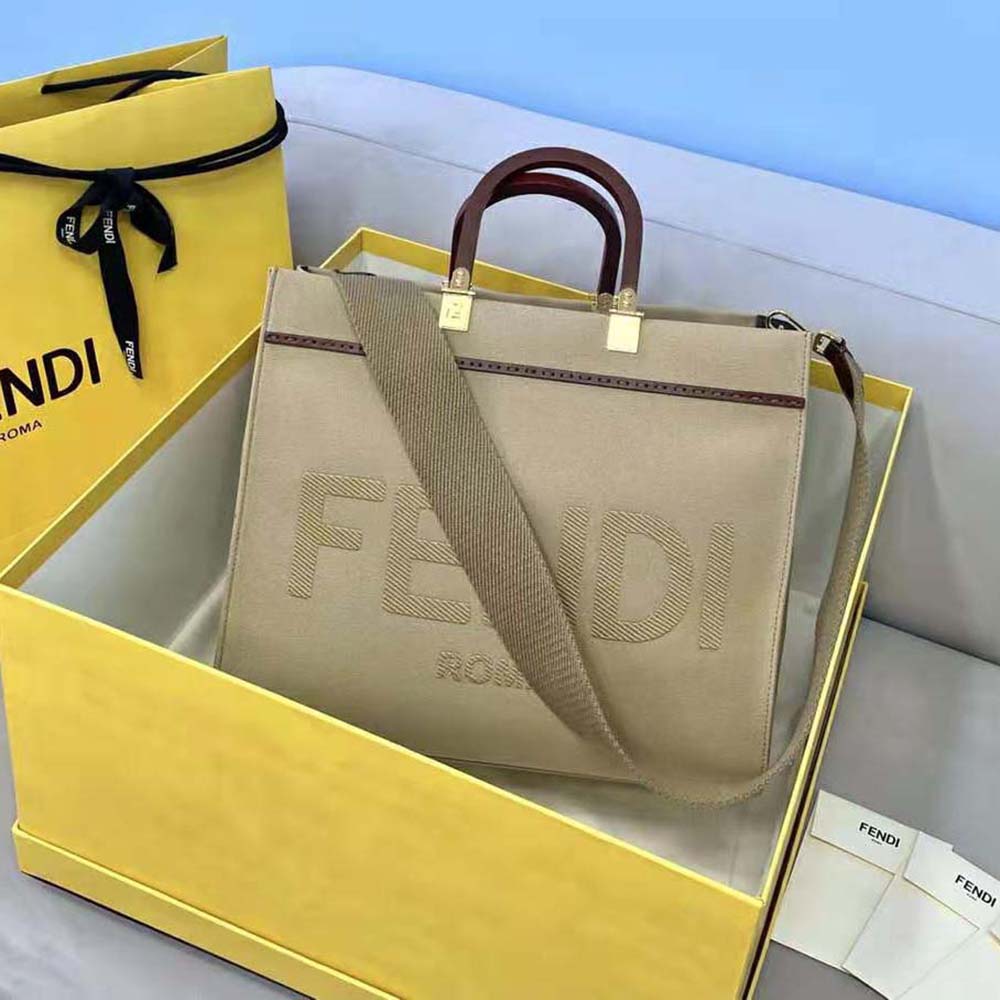 Close-up on gold hardware and canvas texture of Fendi Sunshine bag