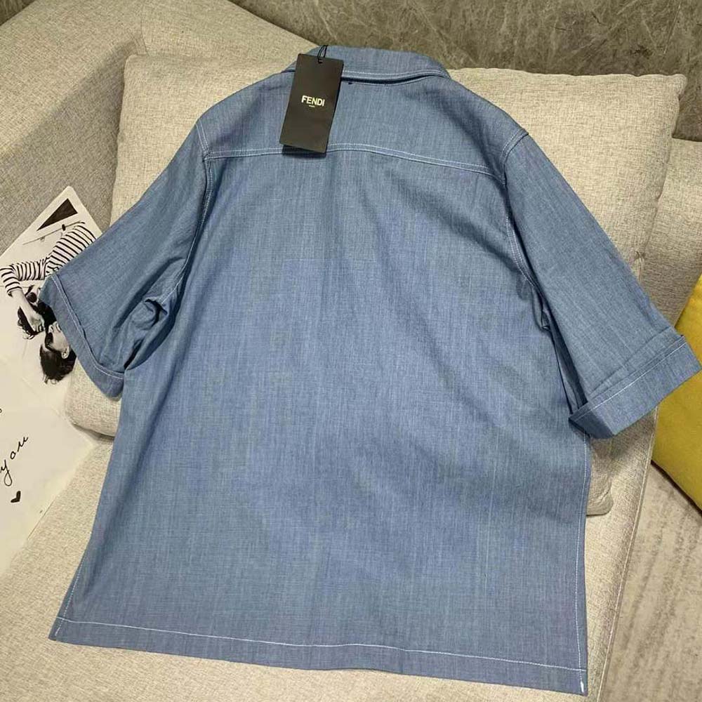 Side angle of Fendi Women Light Blue Chambray Chirt highlighting relaxed silhouette