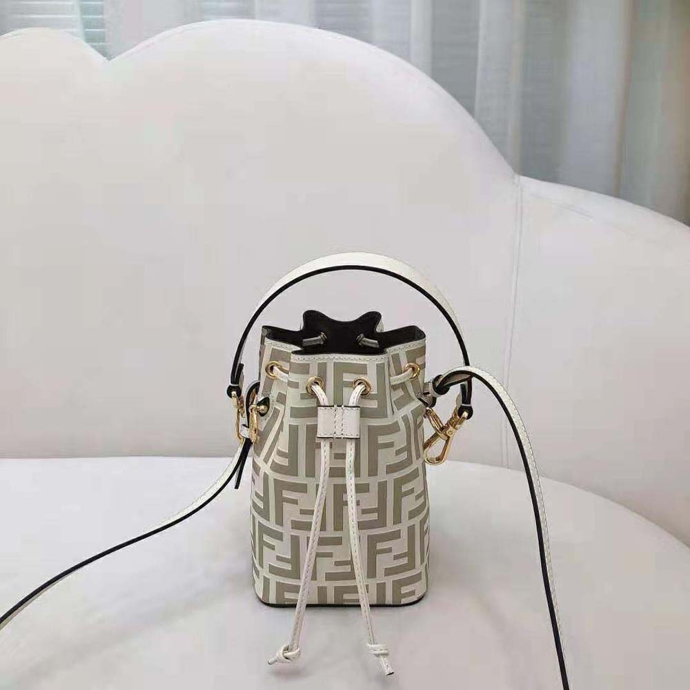 Detail shot of gold-tone push-lock closure on Fendi Women Mon Tresor Beige Leather Mini-Bag