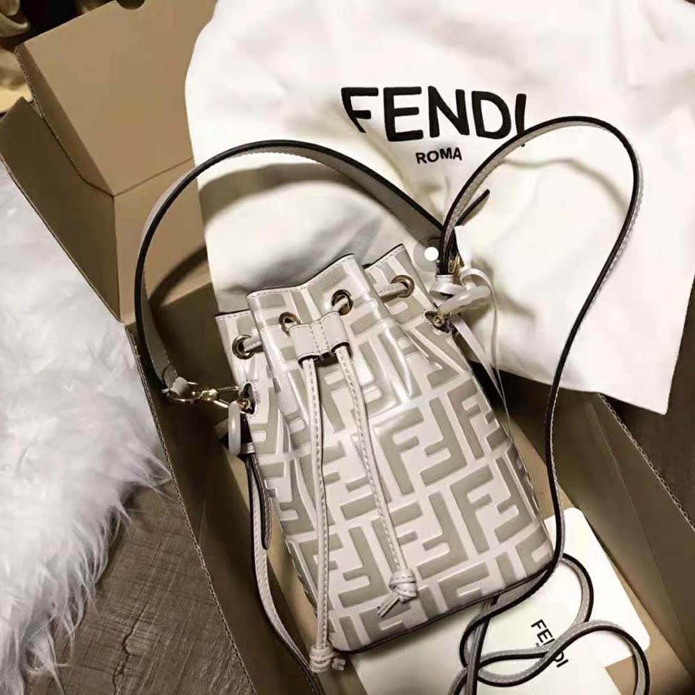 Side view showing slim profile of Fendi Women Mon Tresor Beige Leather Mini-Bag