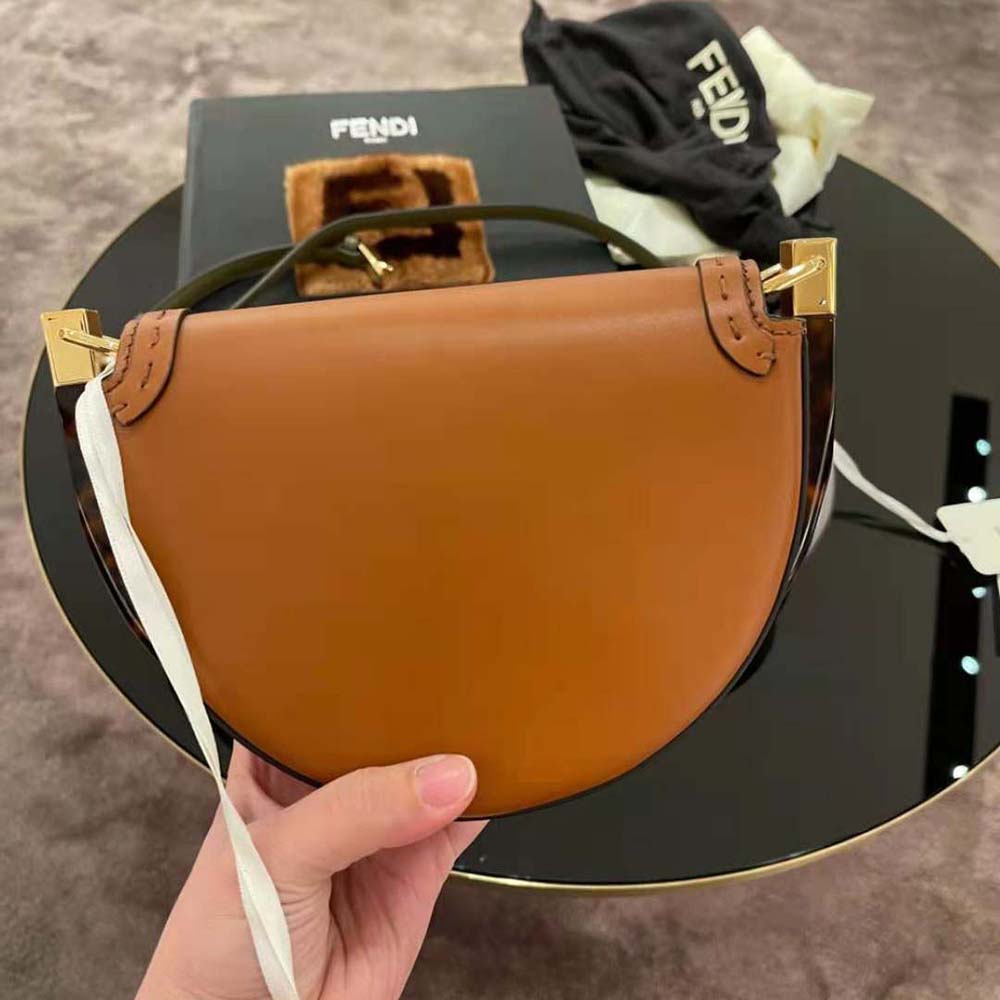 Side angle showing gold hardware on Fendi Moonlight satchel bag