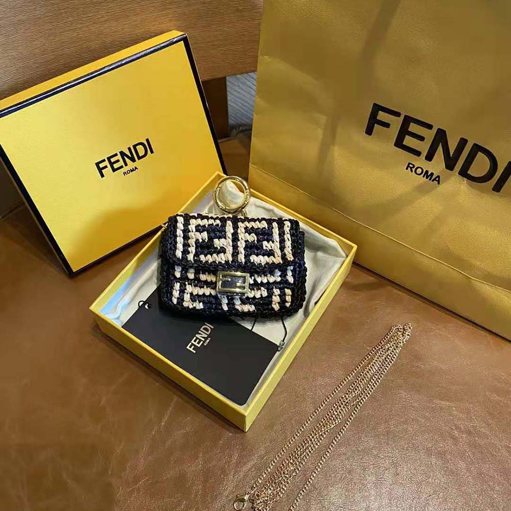 Side angle highlighting compact size of Fendi Women Nano Baguette Charm Black Raffia Charm