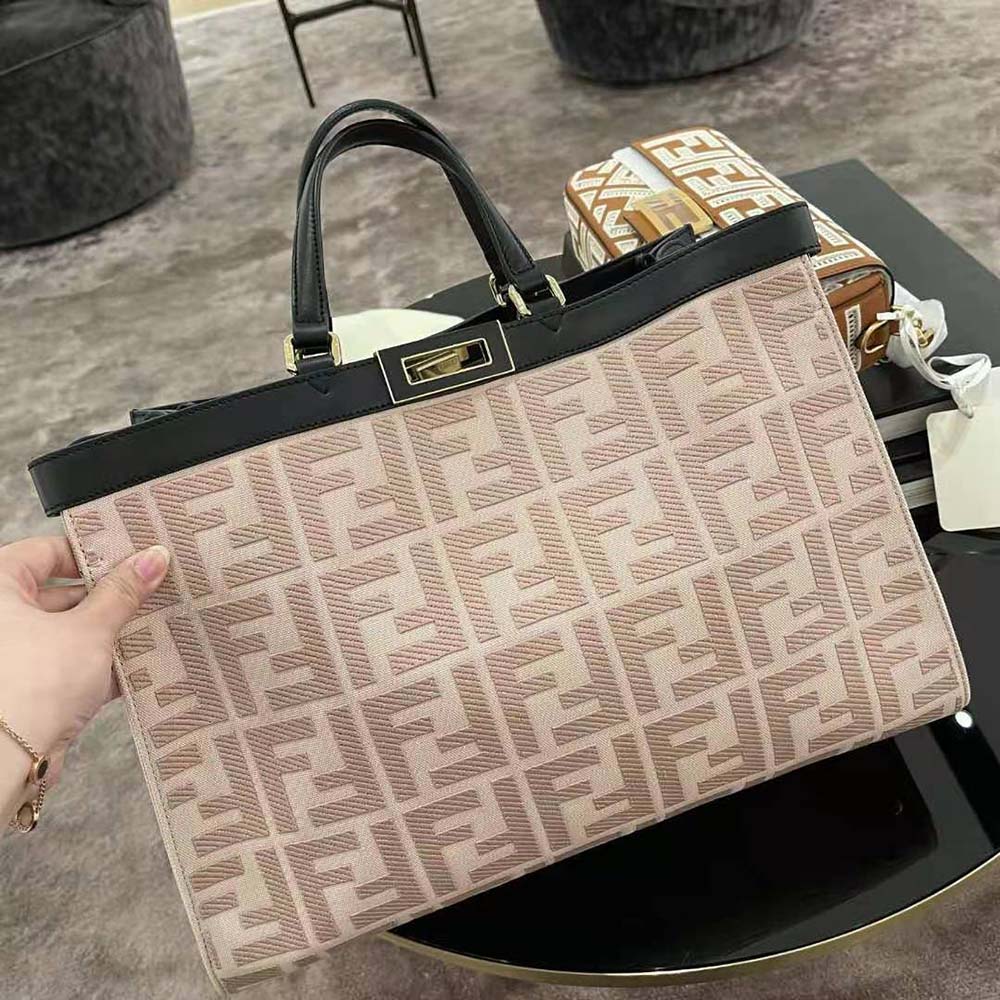 Side angle showing spacious interior and structure of Fendi pink tote