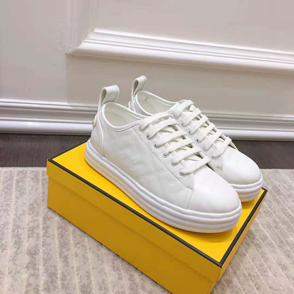 Overhead shot showing white leather and chunky flatform sole details