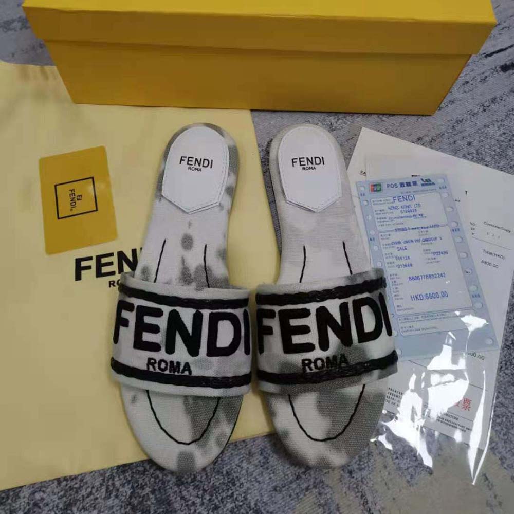Close-up detail of silver hardware on Fendi Women Signature Slides Gray Canvas Slides
