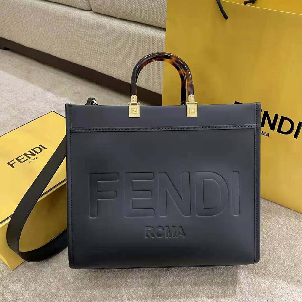 Close-up of gold-tone hardware on Fendi Women Sunshine Medium Leather Shopper-Black