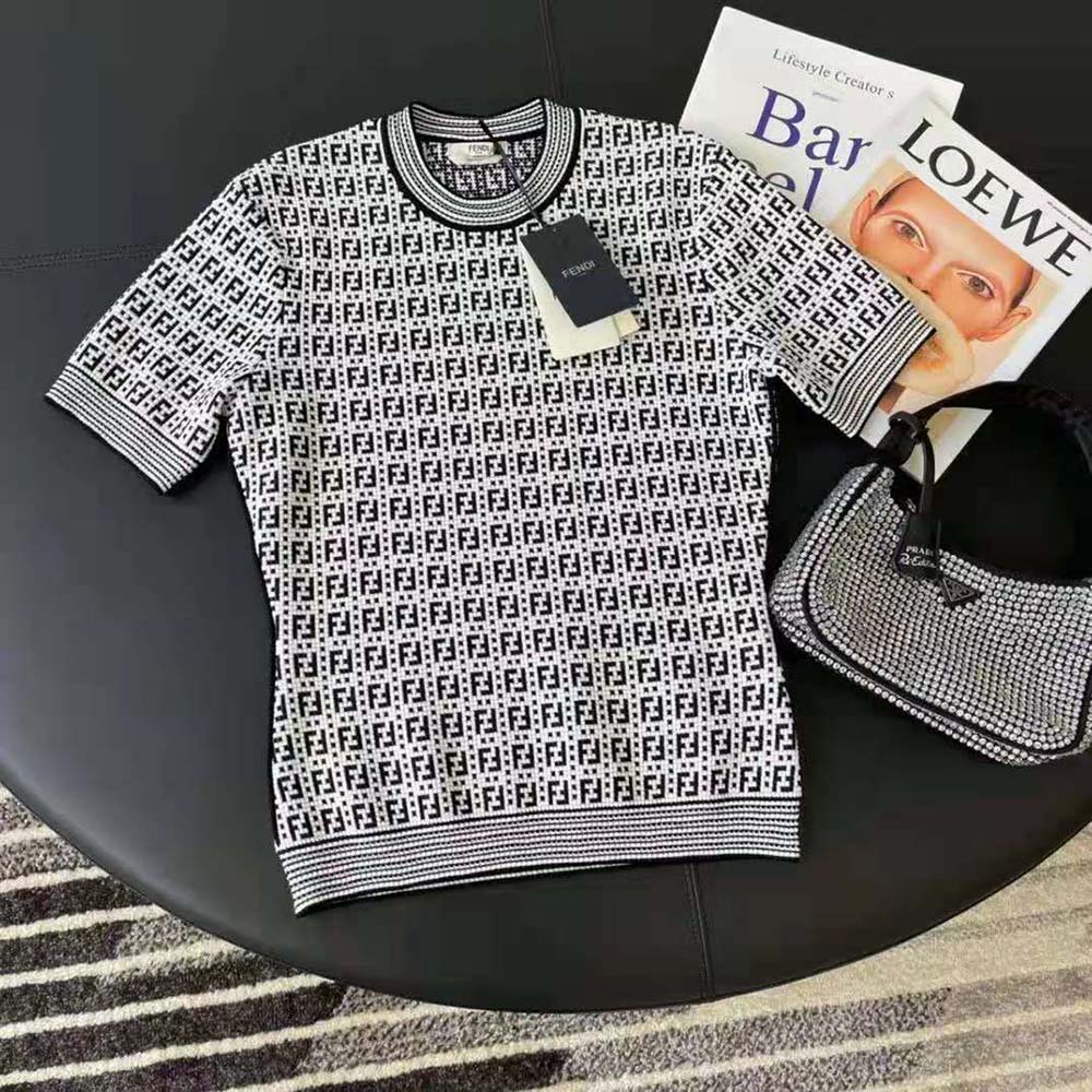 Side angle of Fendi Women White Viscose Sweater showing relaxed fit