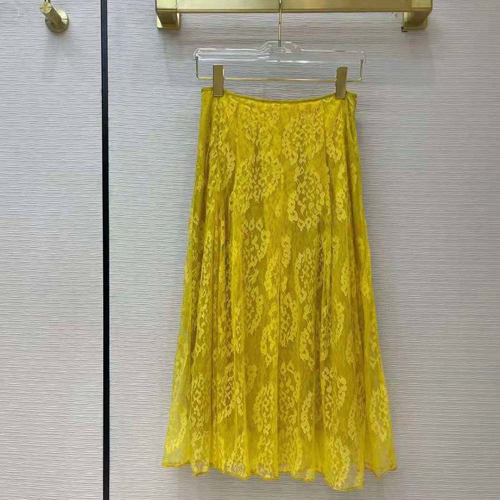 Side angle showing silhouette and zipper closure of Fendi yellow lace skirt