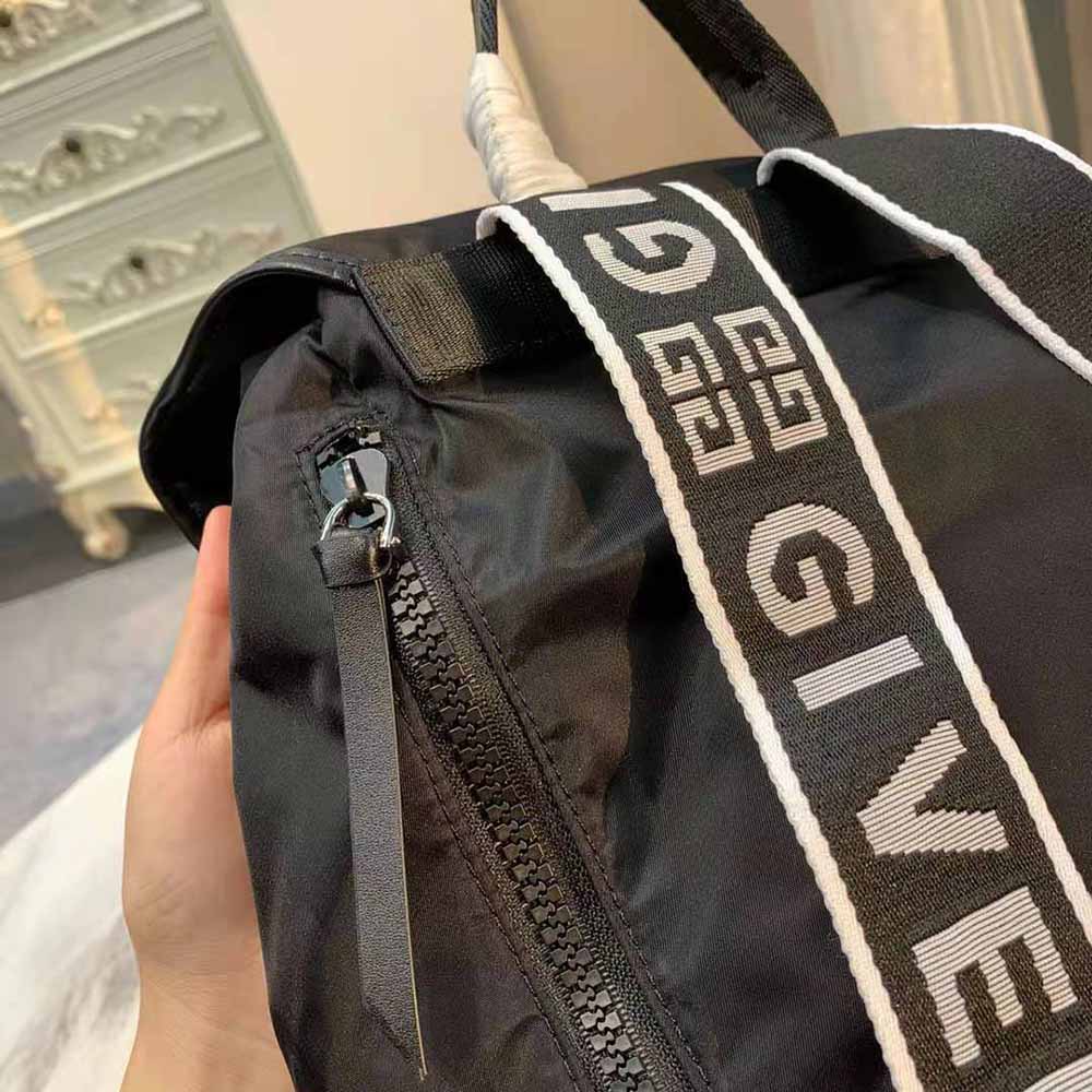 Side angle showing adjustable strap and zip closure of Givenchy backpack