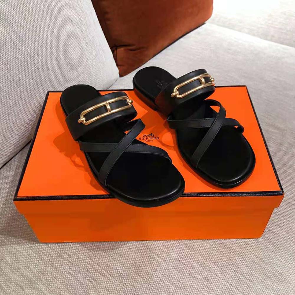Close-up on signature H-shaped cutout detail of Hermes Women Claire Sandal