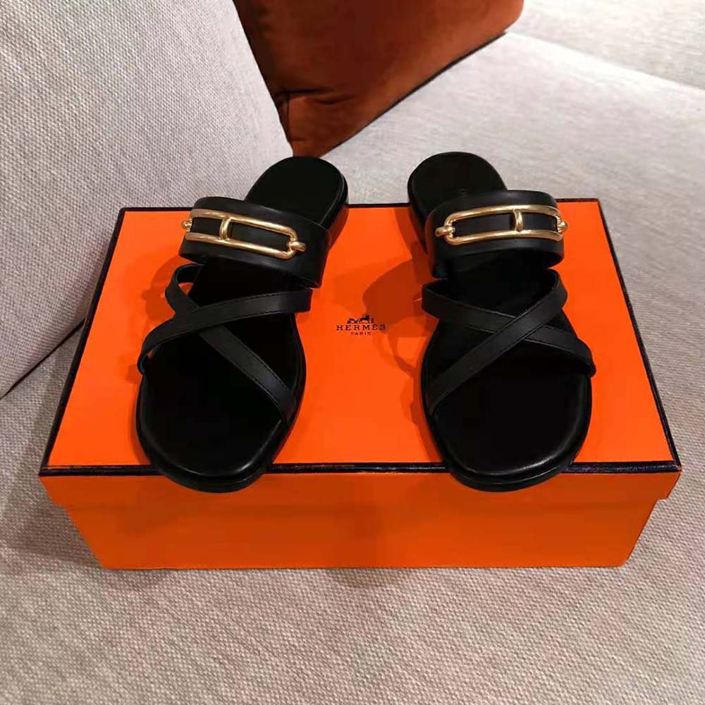 Top-down look at the sleek black calfskin leather of Hermes Women Claire Sandal