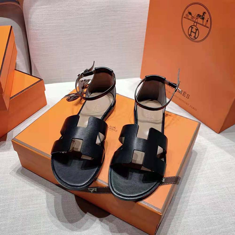 Close-up of black calfskin and Hermes signature 'H' hardware detail