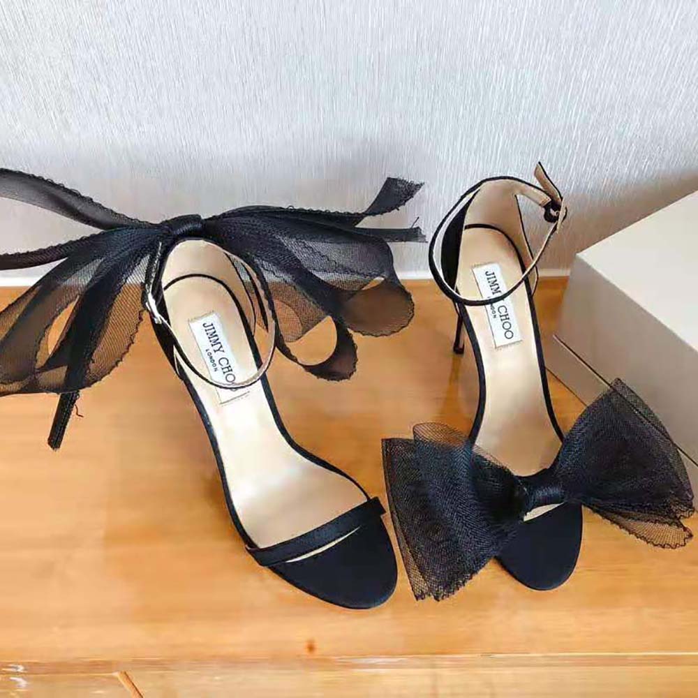 Side view of Jimmy Choo Women Aveline 100 Black Sandals showcasing heel height