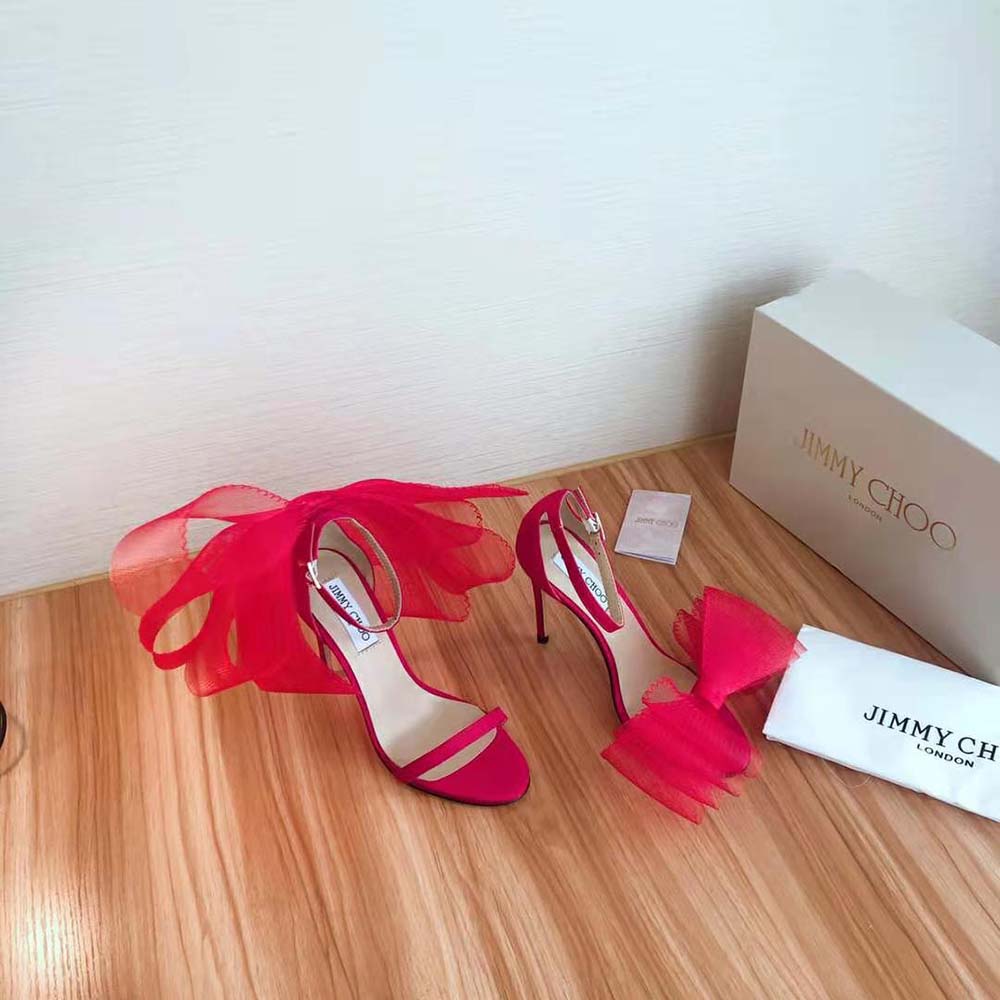 Close-up of asymmetric grosgrain mesh bows on Jimmy Choo Aveline sandals
