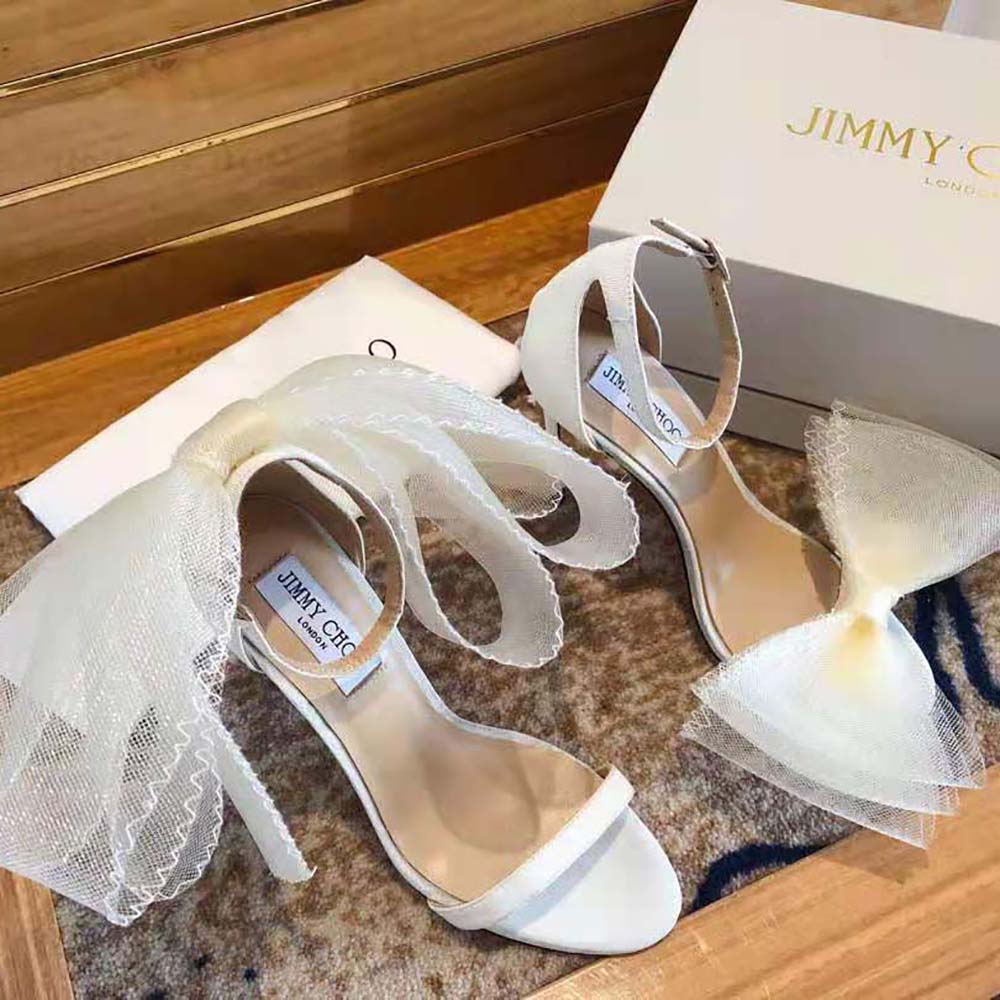 Overhead view showcasing white leather and 100mm stiletto on Jimmy Choo sandals