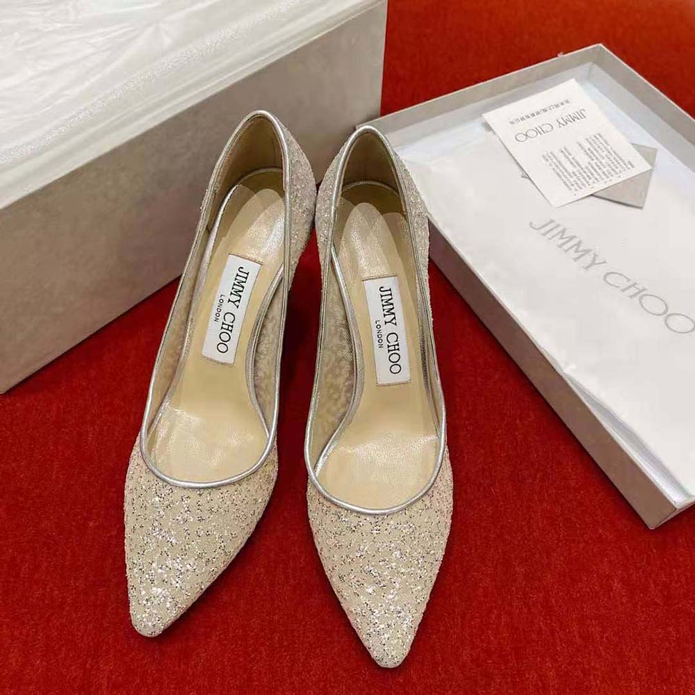 Close-up on pointed toe and glitter tulle detail of Romy 85 pumps