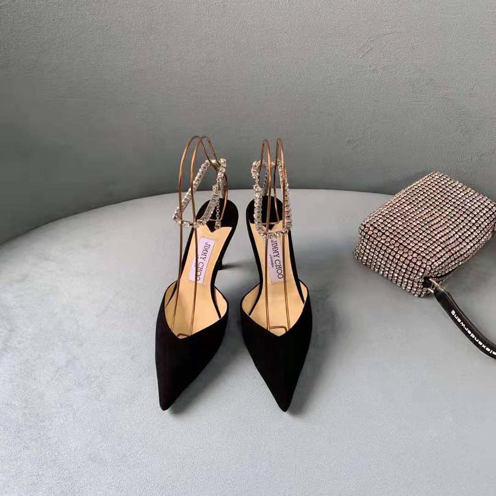 Close-up of crystal embellishment on Jimmy Choo Saeda 100 Black Suede Pumps