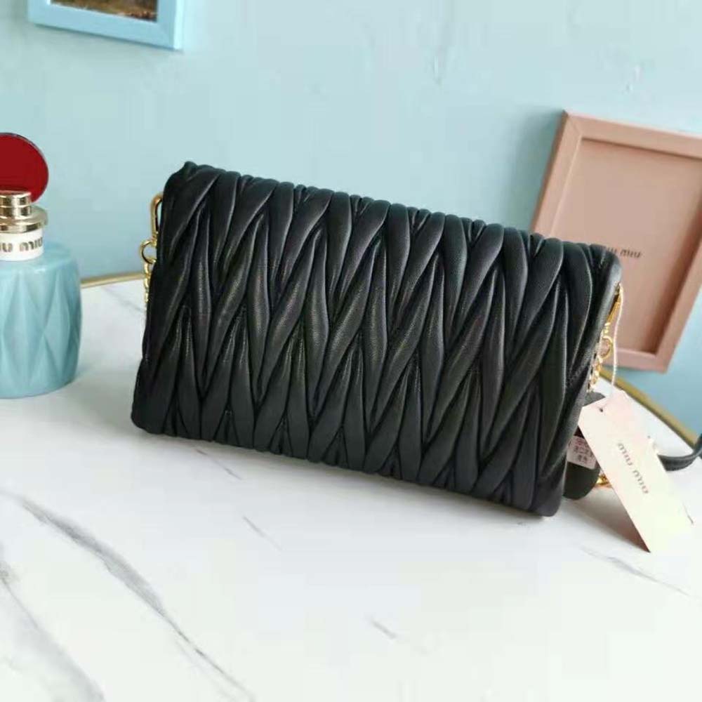 Side angle highlighting compact silhouette of Miu Miu Women Matelasse Nappa Leather Shoulder Bag-Black