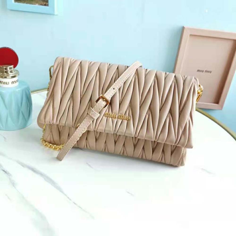 Close-up of matelassé quilted texture on Miu Miu pink shoulder bag