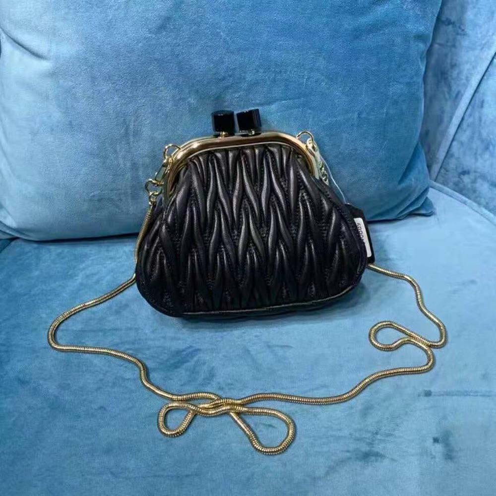 Side angle showing compact silhouette of Miu Miu Women Miu Belle Mini-Bag-Black