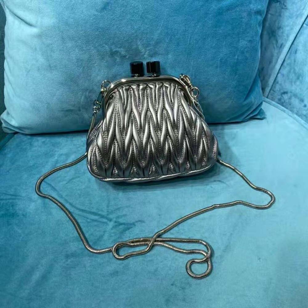 Side profile showing compact silhouette of Miu Miu Women Miu Belle Mini-Bag