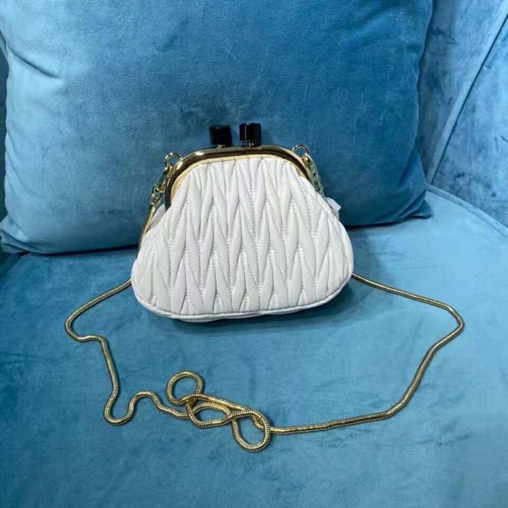 Side angle showing slim profile of Miu Miu Women Miu Belle Nappa Leather Mini-Bag-White