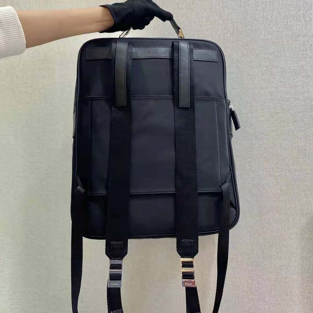 Side angle showing silver hardware on Prada Men Fabric Backpack Accented with Fine Saffiano Leather Trim