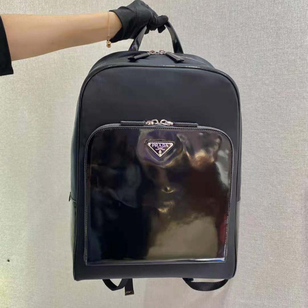 Close-up of silver Prada logo plaque on Re-Nylon and Leather Backpack-Black