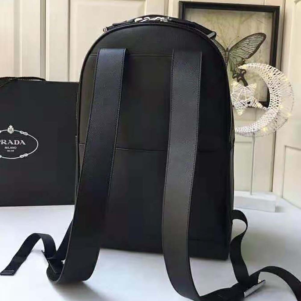 Side profile showing structured silhouette of Prada Men Saffiano Leather Backpack-Black