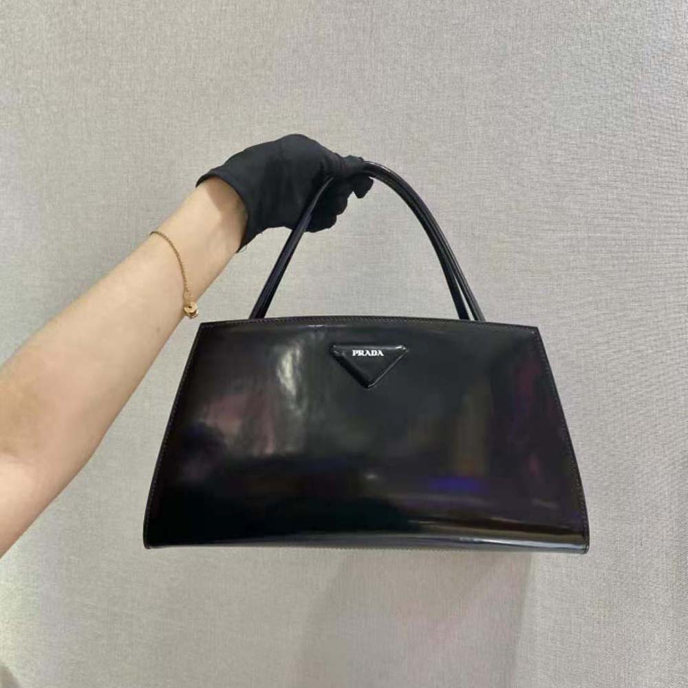Close-up of silver-tone hardware on Prada Women Brushed Leather Handbag-Black