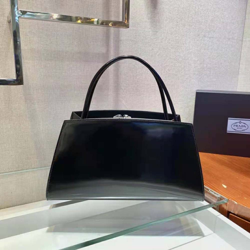Side profile showing compact shape of Prada Women Brushed Leather Handbag-Black