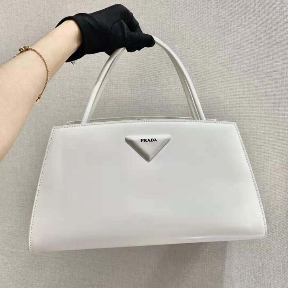 Close-up of polished hardware on Prada Women Brushed Leather Handbag-White