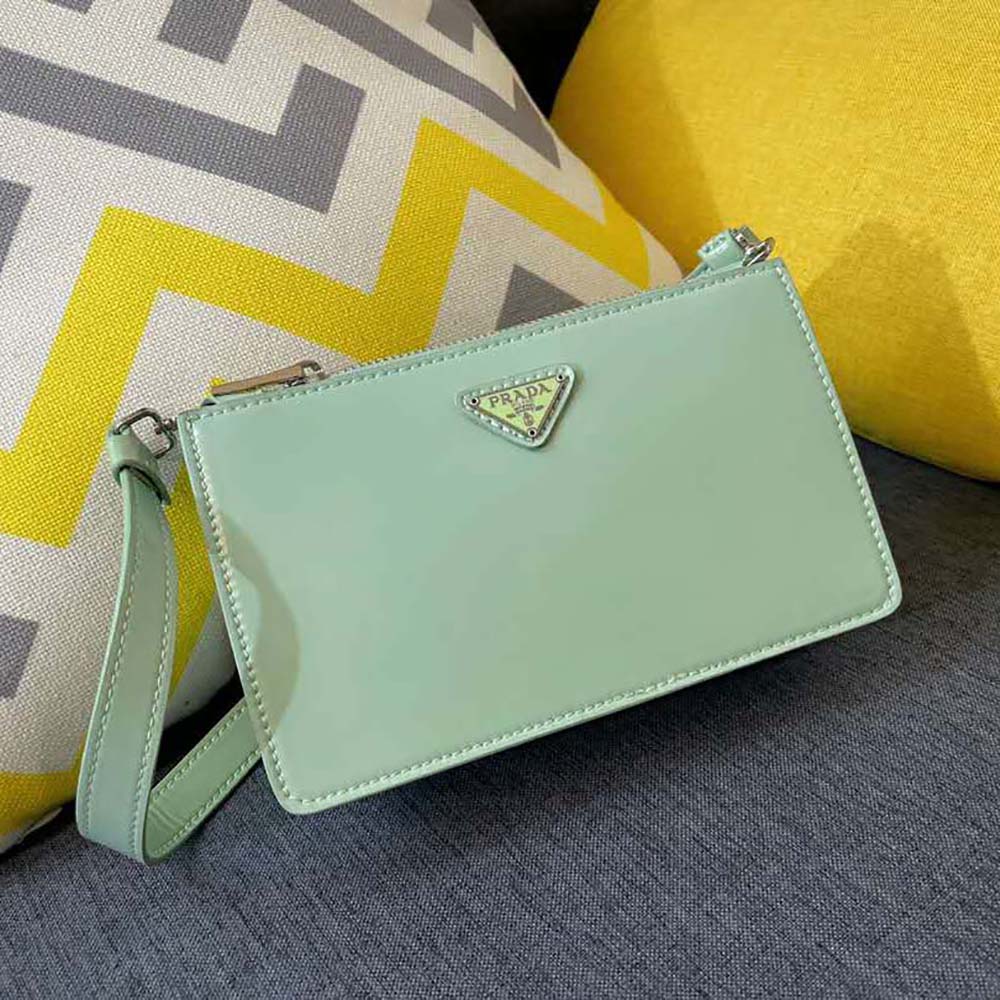 Close-up of brushed leather texture and silver hardware on Prada mini-bag