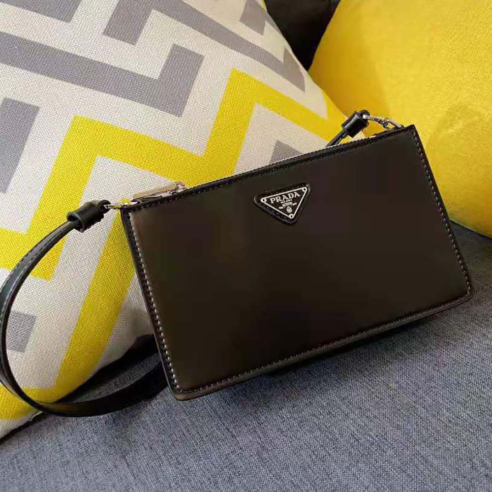 Side angle showing adjustable strap and compact silhouette of Prada mini-bag