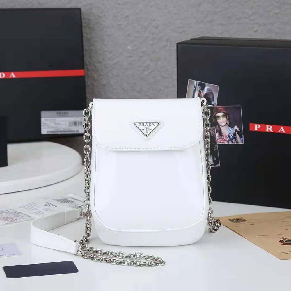 Close-up of polished metal hardware on Prada Women Brushed Leather Mini-bag White