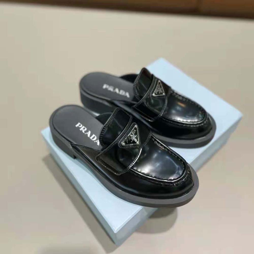 Back angle showing open heel and block heel of Prada leather mules