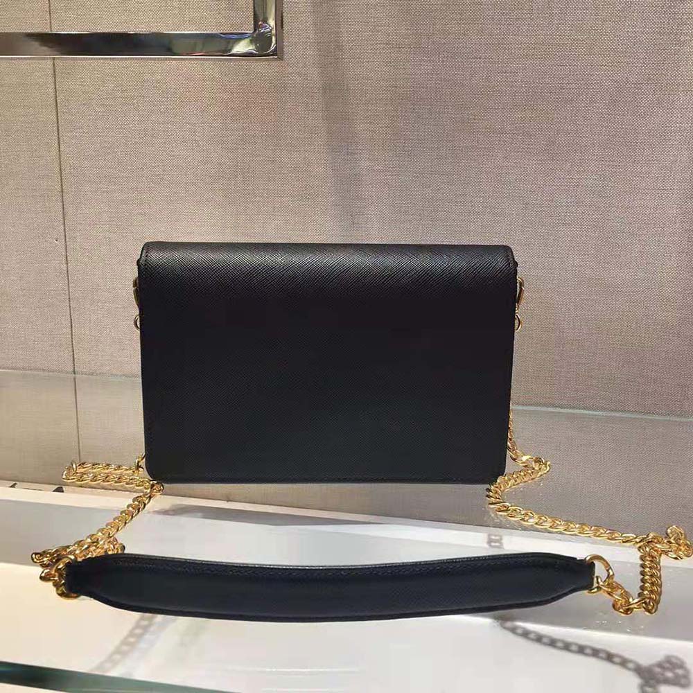 Side angle showing compact silhouette of Prada Women Leather Mini-Bag-Black