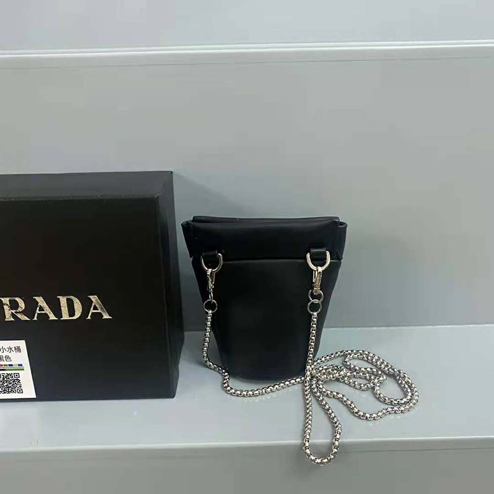 Side angle showcasing compact silhouette of Prada mini-pouch