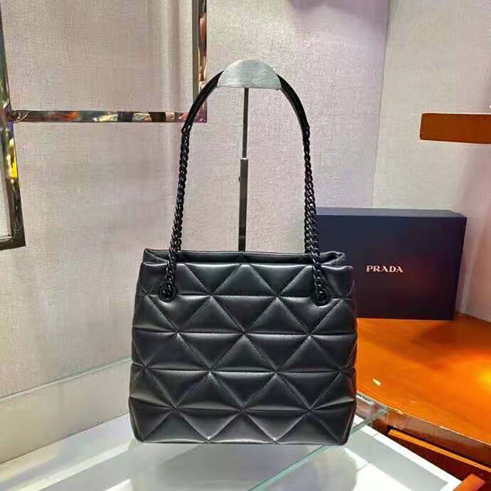 Side angle showing silver hardware on Prada Spectrum Tote-Black