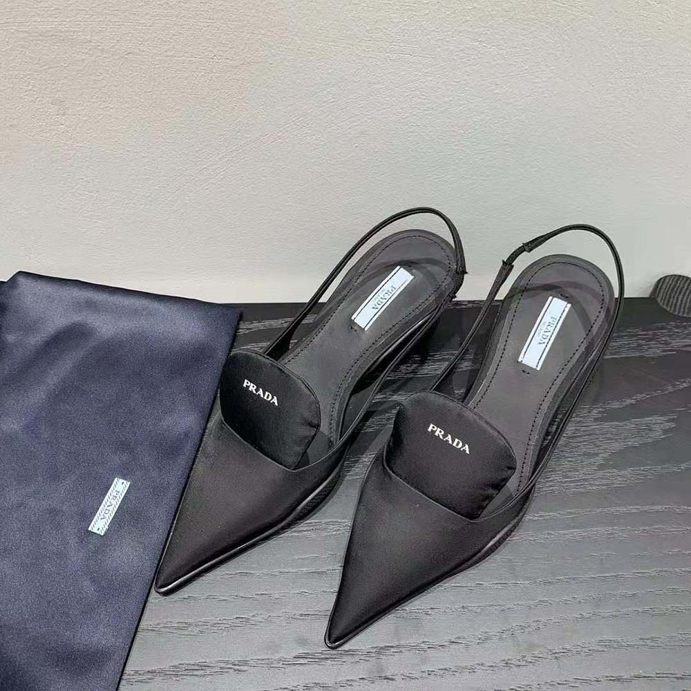 Close-up detail of Prada metal logo on slingback strap