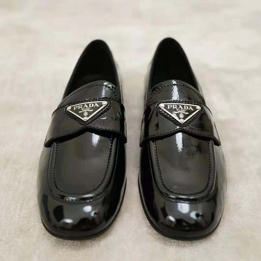 Top-down angle showcasing slip-on design of Prada Women Patent Leather Loafers