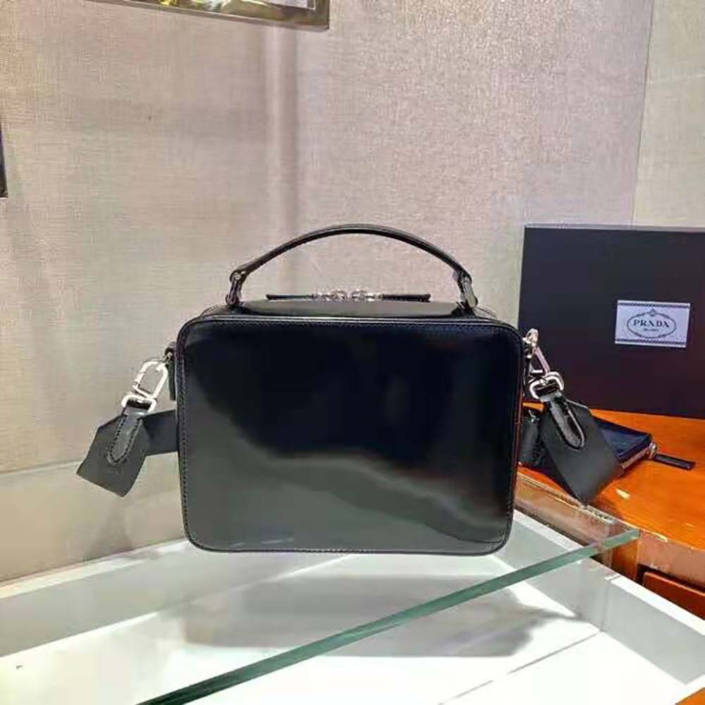 Side angle highlighting slim profile of Prada Women Prada Brique Brushed Leather Bag-Black