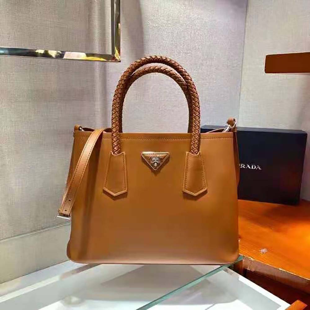 Close-up of gold-tone hardware on Prada Women Prada Double Medium Leather Handbag-Brown